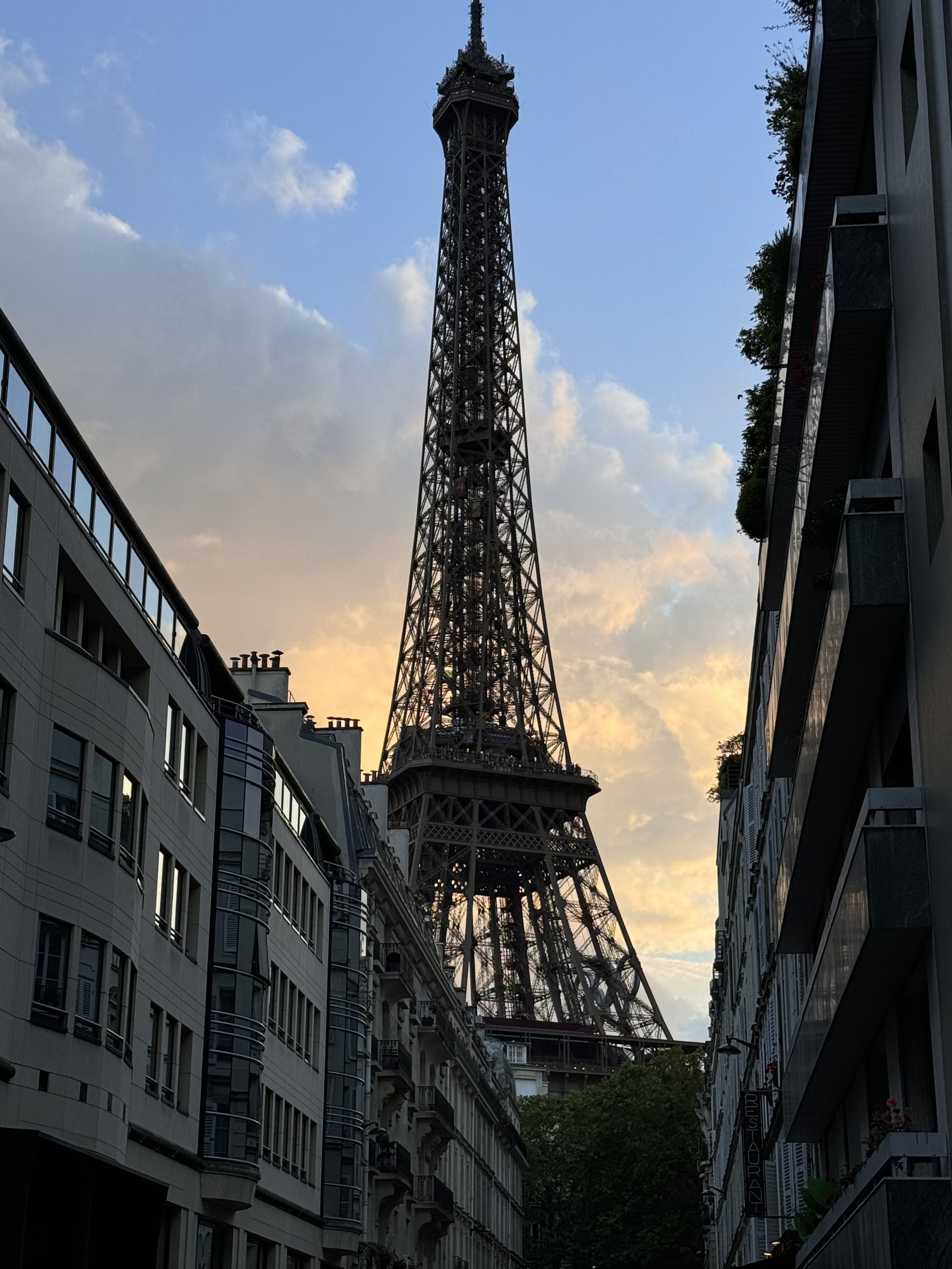 The Eiffel Tower framed by a quiet Right Bank street