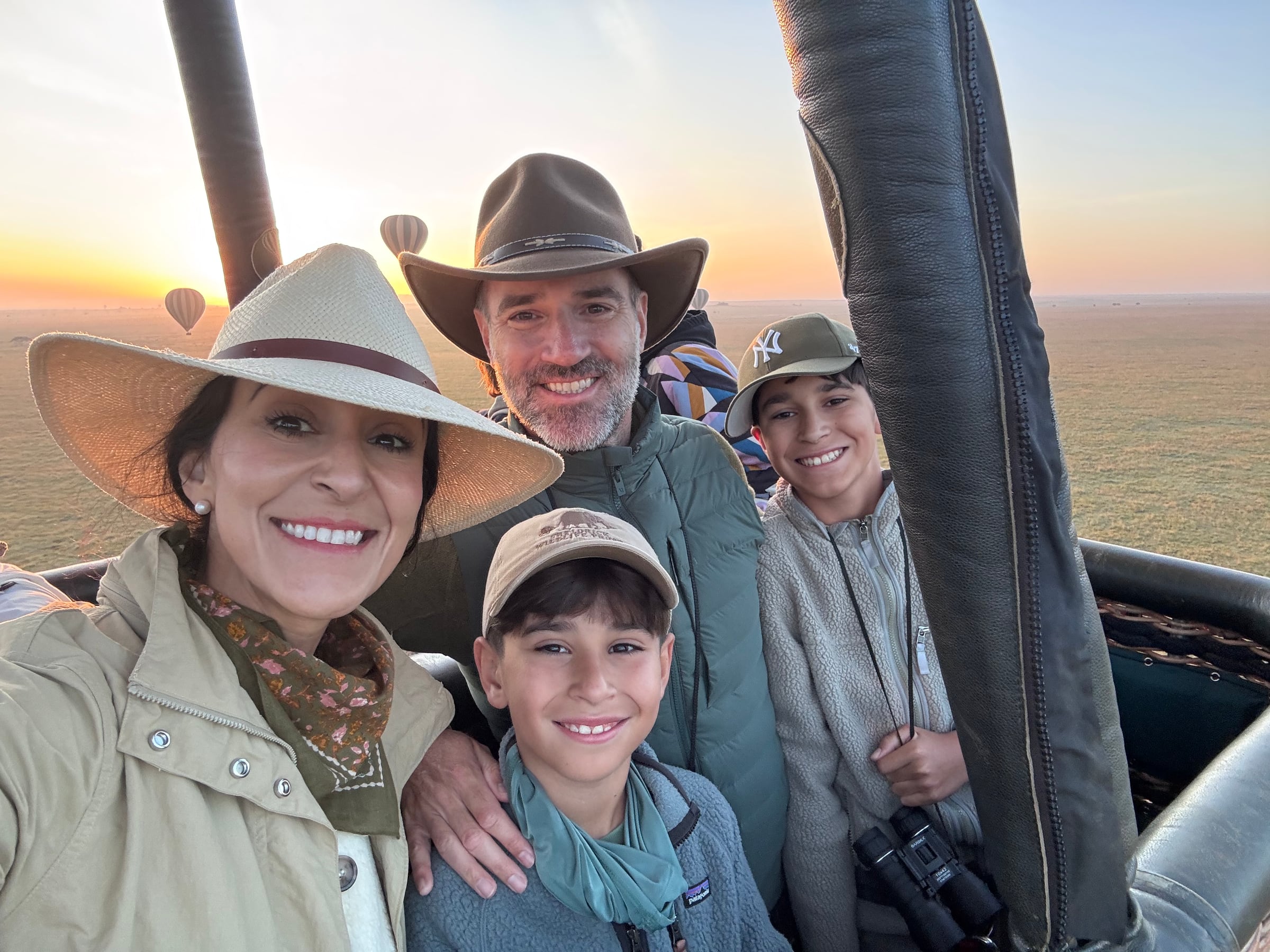 Monica and the family at sunrise in a hot air balloon over the Serengeti