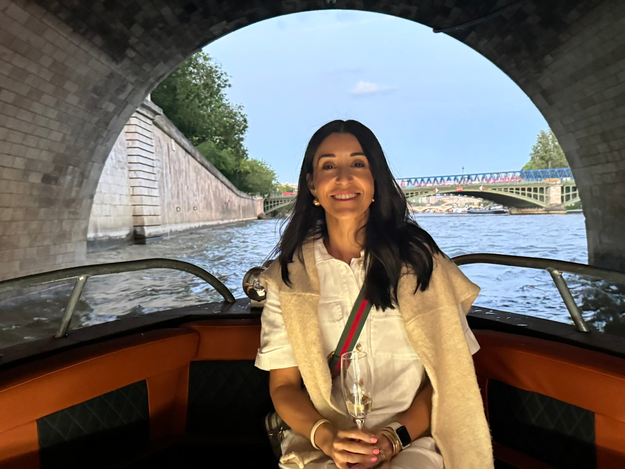 Cruising a canal beneath a stone bridge