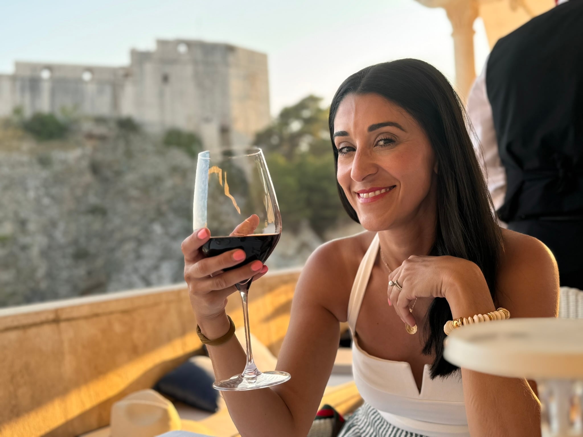 Toasting with wine above the Adriatic