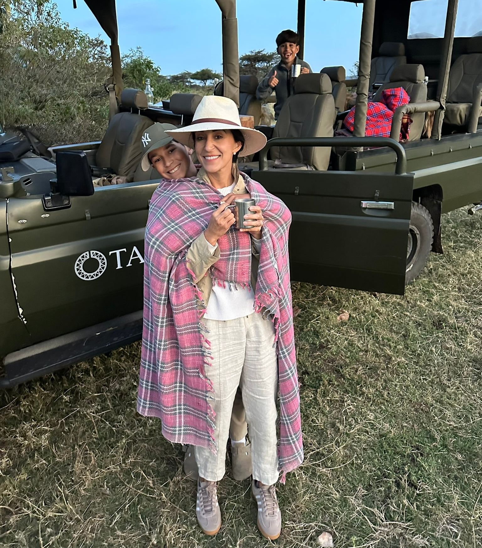 Wrapped up together on an early-morning safari game drive