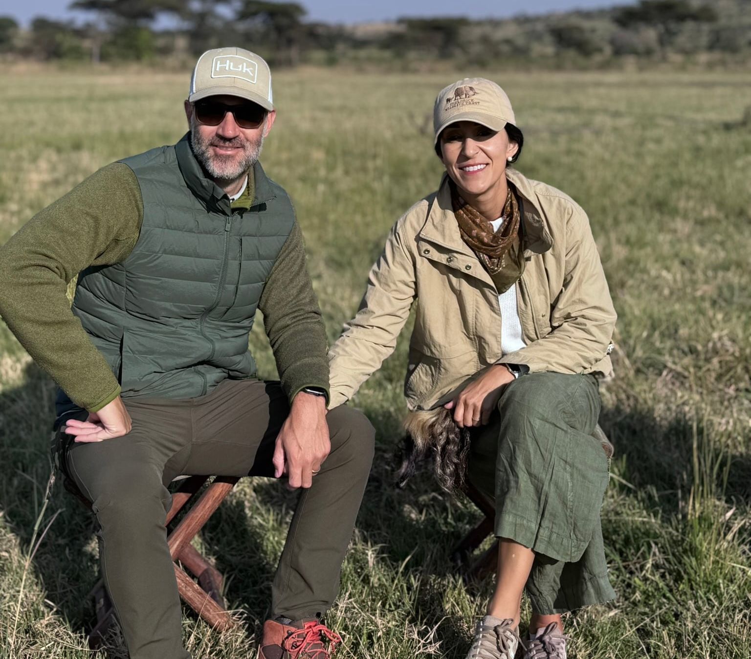Kneeling together on the Serengeti savanna